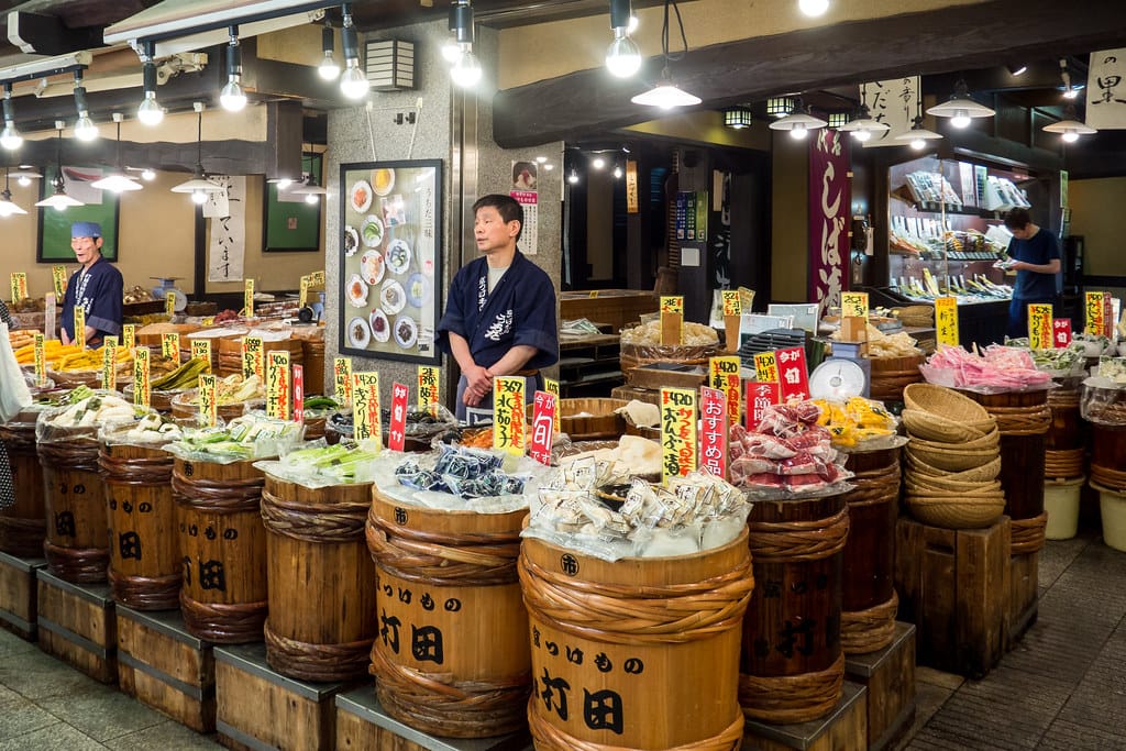 Nishiki Market or visit Daimaru Depachika for local gourmet foods